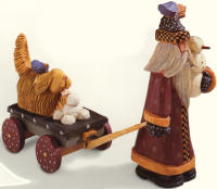 WW2232 Santa holding snowman pulling dog on cart
