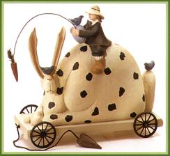 ww7501 Boy all dressed up riding large bunny pull toy