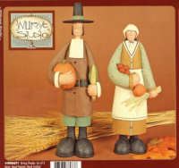 WW6071 Mr. and Mrs. Pilgrim hold harvest foods